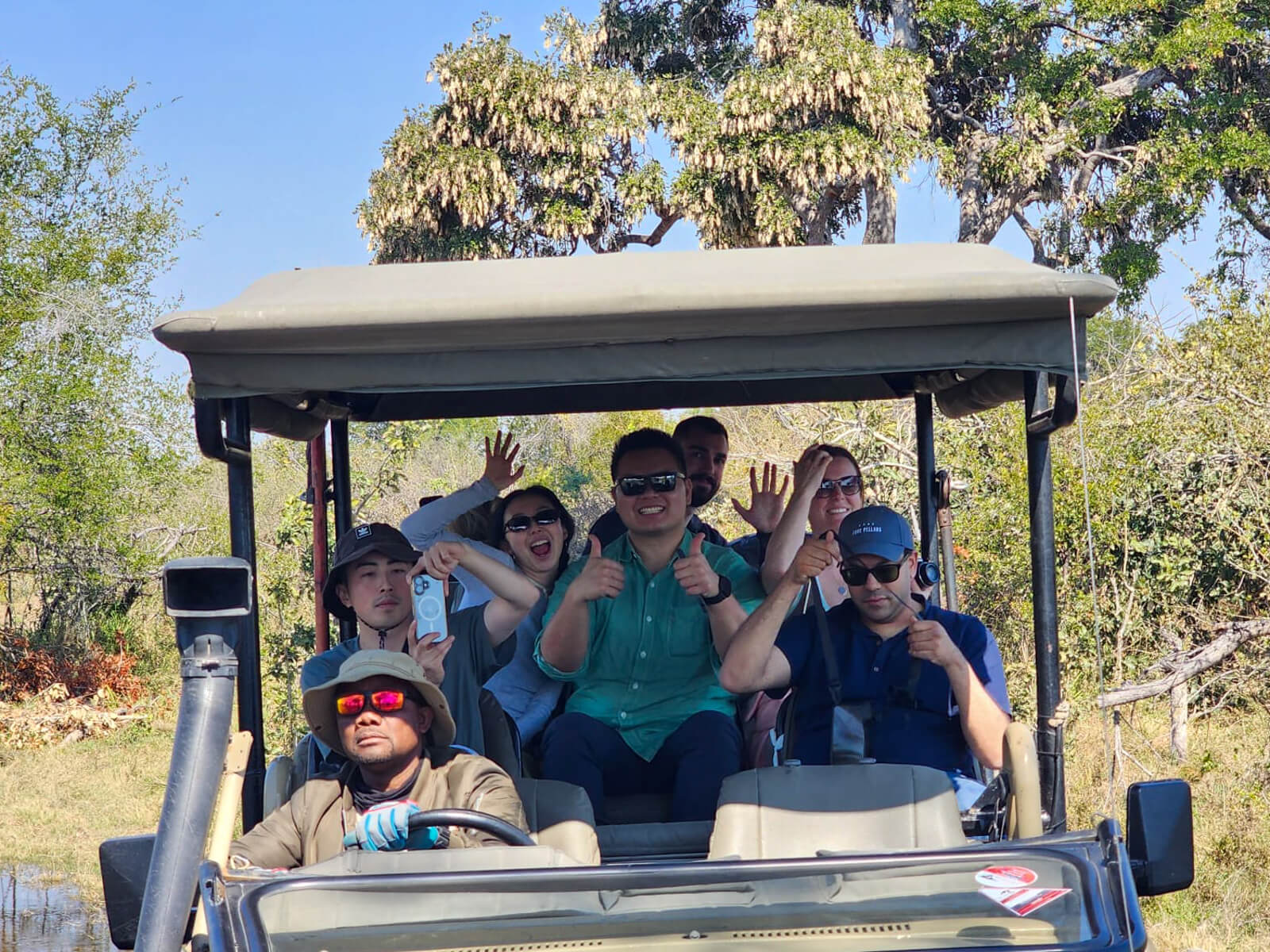 Tourists in a safari jeep in the Okavango Delta